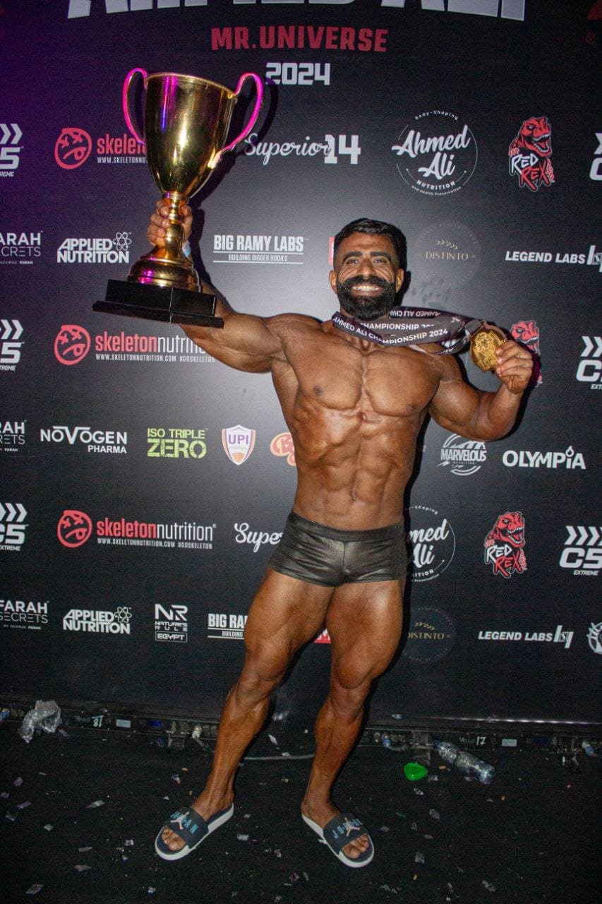 Coach holding up a trophy after a win